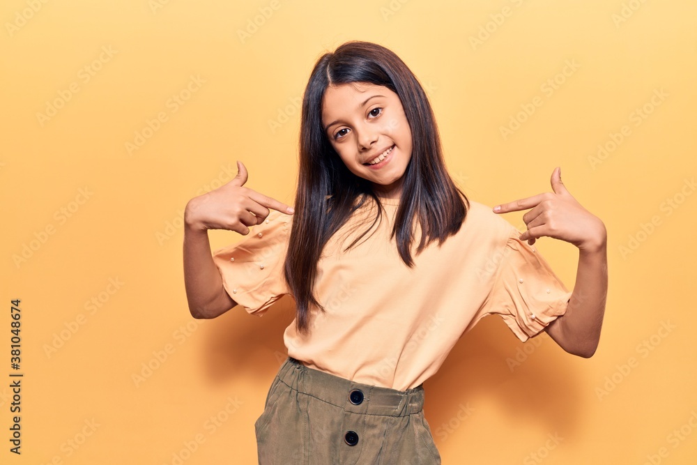 Beautiful child girl wearing casual clothes looking confident with smile on face, pointing oneself with fingers proud and happy. Beautiful child girl wearing casual clothes looking confident with smile on face, pointing oneself with fingers proud and happy.