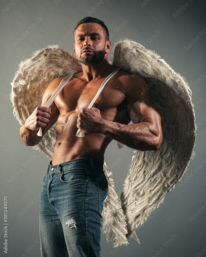 Muscular guy with angel wings and sexy torso. Stock Photo | Adobe Stock