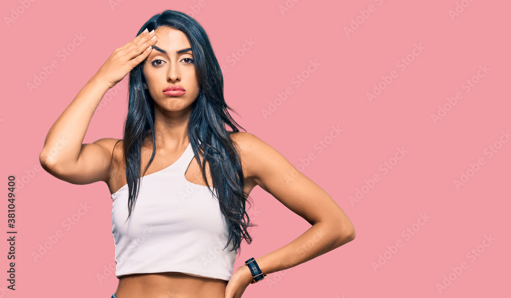 Beautiful hispanic woman wearing casual clothes worried and stressed about a problem with hand on forehead, nervous and anxious for crisis Beautiful hispanic woman wearing casual clothes worried and stressed about a problem with hand on forehead, nervous and anxious for crisis