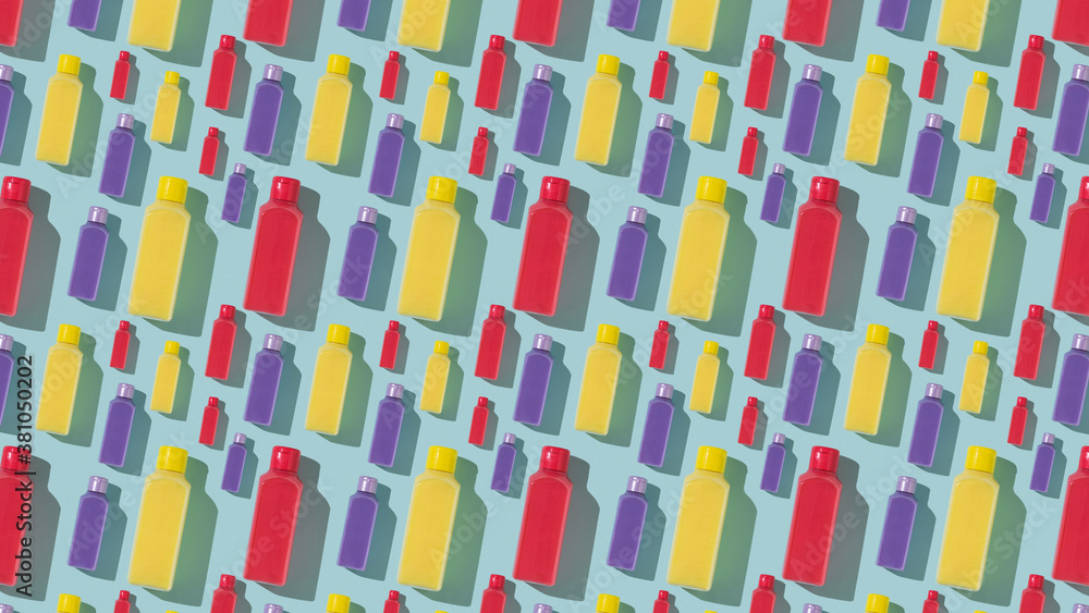 Colorful plastic bottles on a blue background. Colorful plastic bottles on a blue background.