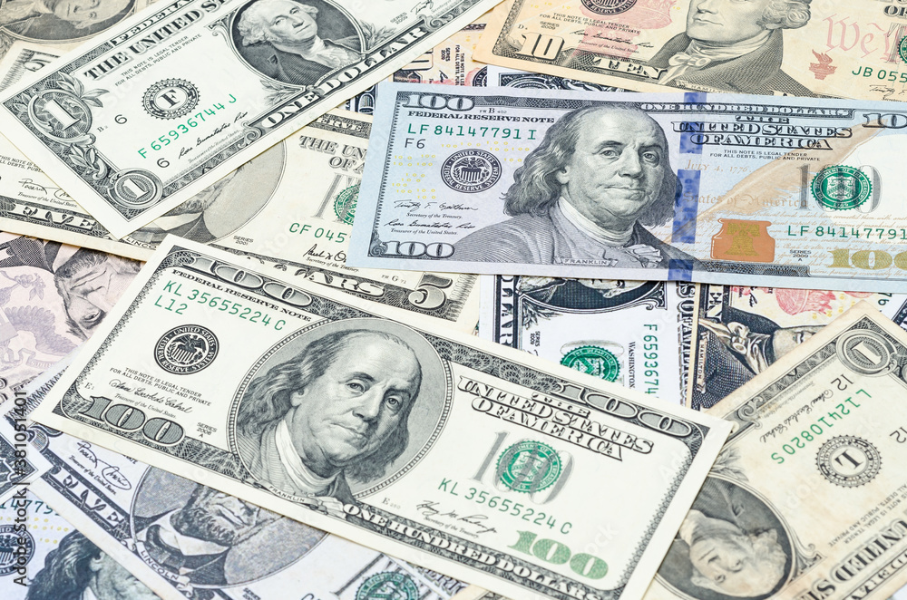 The U.S. dollars banknotes of the united States of America. The stack of money for the financial concept of earnings or business concept. The U.S. dollars banknotes of the united States of America. The stack of money for the financial concept of earnings or business concept.