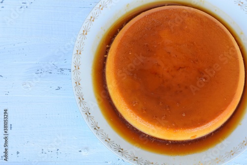 Traditional French creme Brulee dessert with caramelized sugar on top/ Croatian Rozata Rozada served on white wooden background