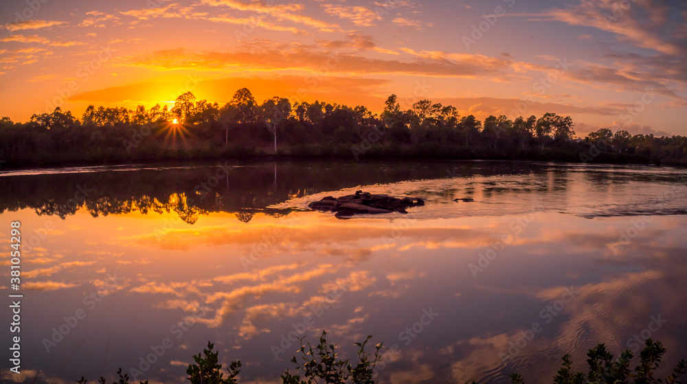 Fototapeta premium Beautiful Riverside Sunrise Panorama with Reflections