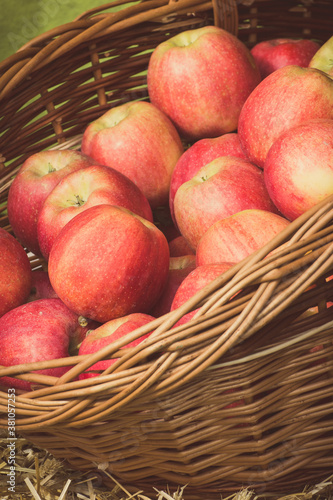 Fresh ripe apples in basket on stall at bazaar. Vintage photo
