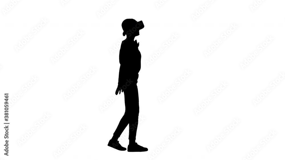 Silhouette Beautiful lady with brunette hair walking and using VR. Silhouette Beautiful lady with brunette hair walking and using VR.