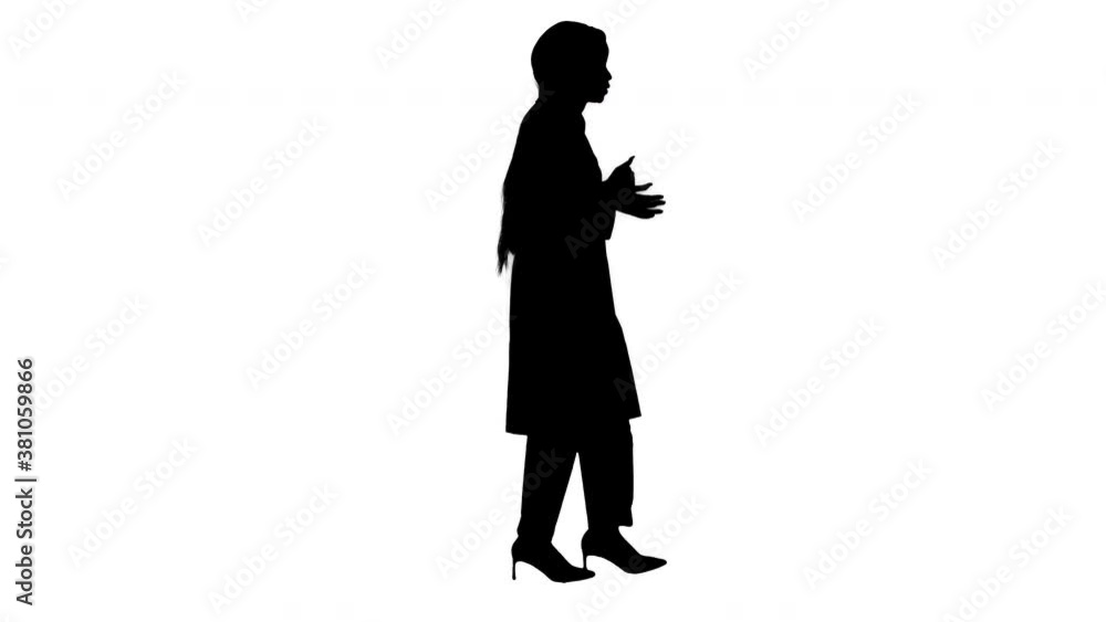 Young african american female doctor talking as she walks, Alpha Channel Young african american female doctor talking as she walks, Alpha Channel