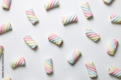 Colorful marshmallow on white background. flat lay, top view. Delicious snacks pattern background photo