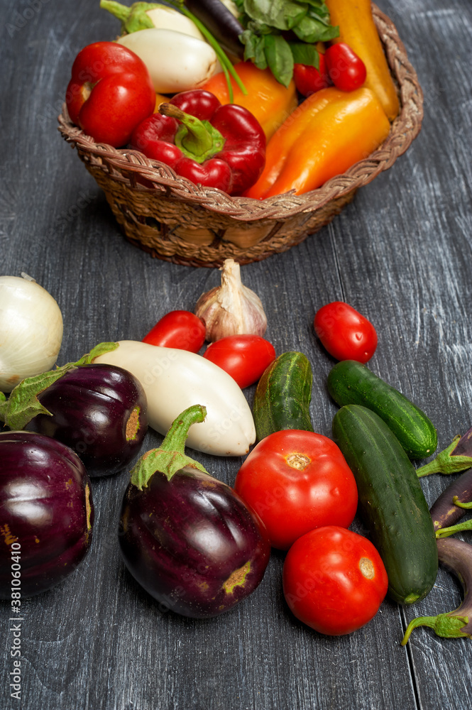 Assortment of fresh home-made vegetables on a dark table Assortment of fresh home-made vegetables on a dark table