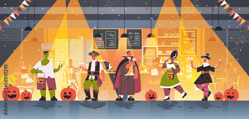people in different costumes celebrating happy halloween holiday mix race men women drinking cocktails having bar party full length horizontal vector illustration