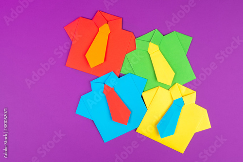 Paper suits on pink backgro...