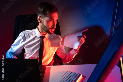 A man is working at a compu...