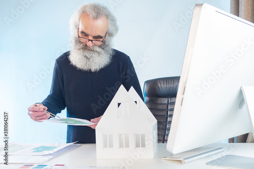 An architect with gray hair...