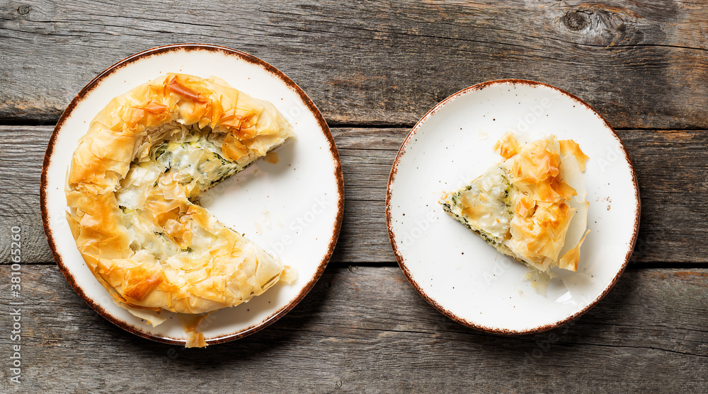 Spanakopita, Greek spinach pie with feta cheese. Spanakopita, Greek spinach pie with feta cheese.