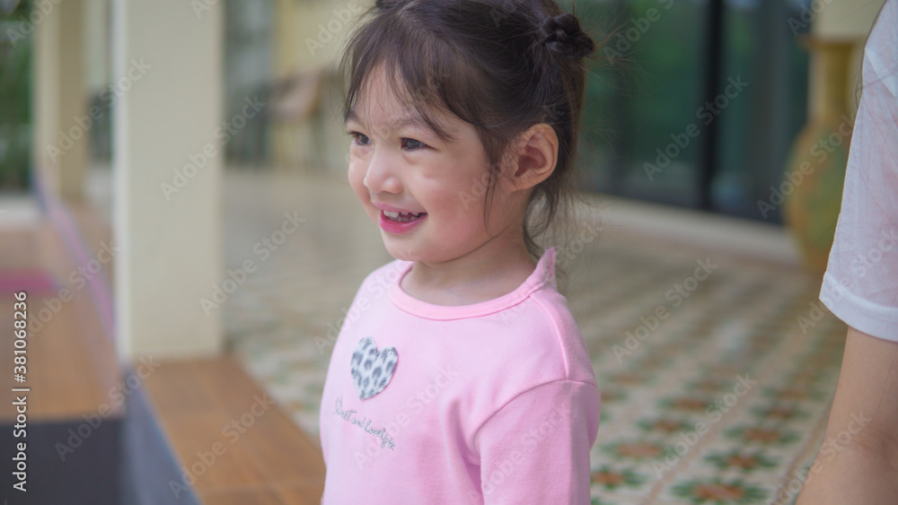 Asian little girl running and walking on grass field. Asian little girl running and walking on grass field.