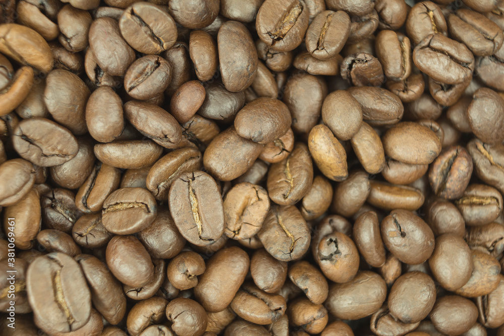 Large quantities of coffee beans as a background with place for text Large quantities of coffee beans as a background with place for text