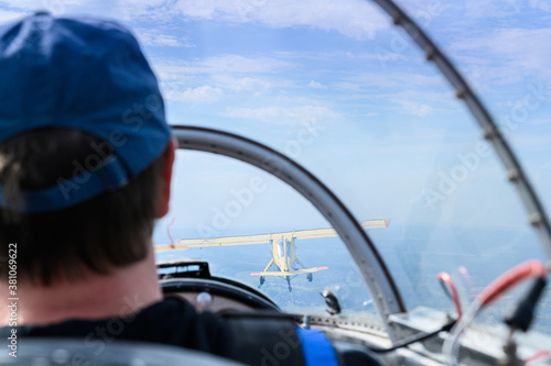 view in the cockpit behind the pilot during the flight