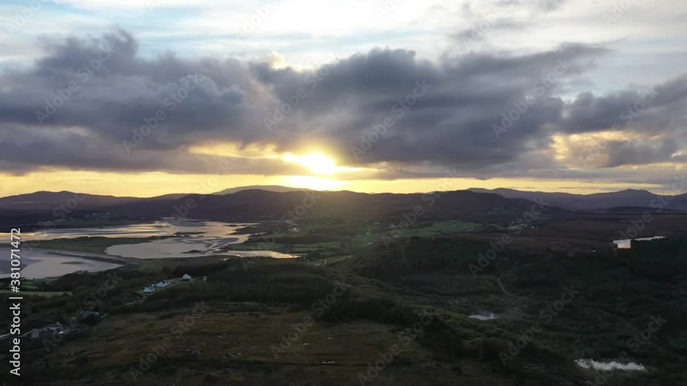 Flying into the sunrise over a peatbog in County Donegal - Ireland. Flying into the sunrise over a peatbog in County Donegal - Ireland.