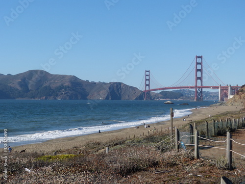 Golden Gate Bridge in San Francisco, California - from Baker Beach. Beautiful perspective with hills and blue sky