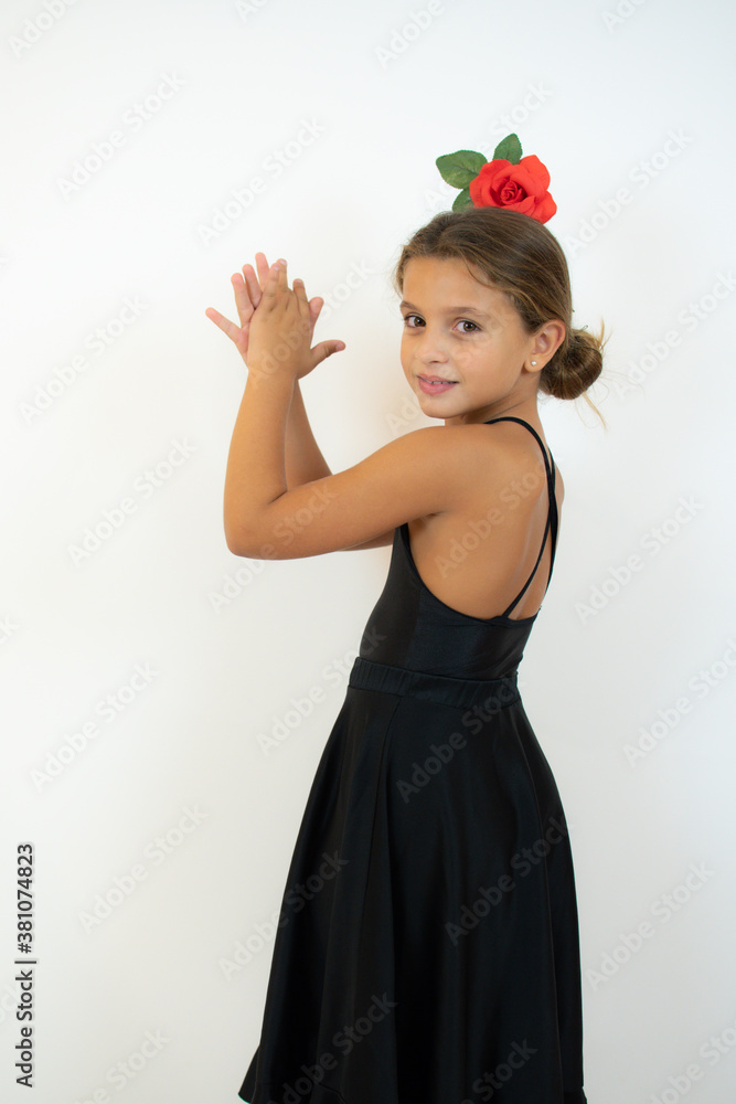 Little girl dancing flamenco in traditional flamenco dress Little girl dancing flamenco in traditional flamenco dress