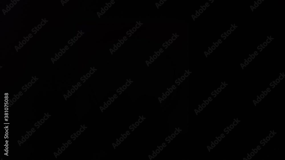 A man's hand turns off the light switch and it becomes dark. Close up. A man's hand turns off the light switch and it becomes dark. Close up.