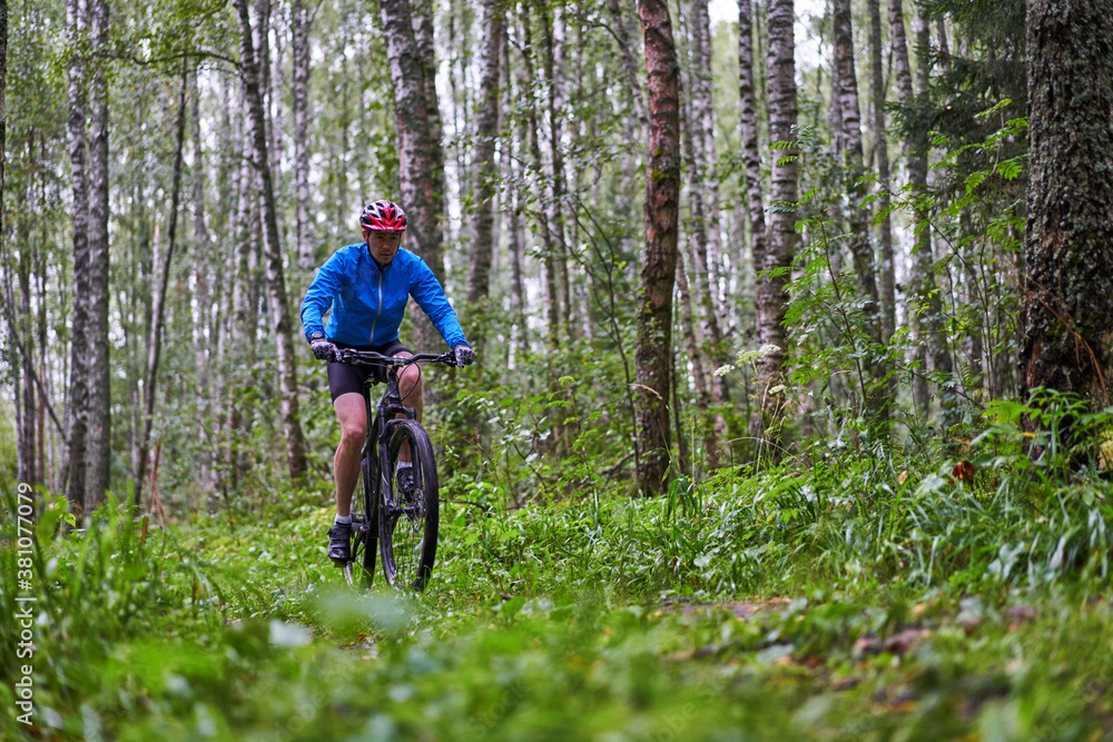 Men is riding on bicycle.