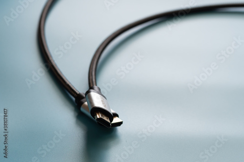 HDMI Cable connector and copy space on blue background color mood and tone style photo