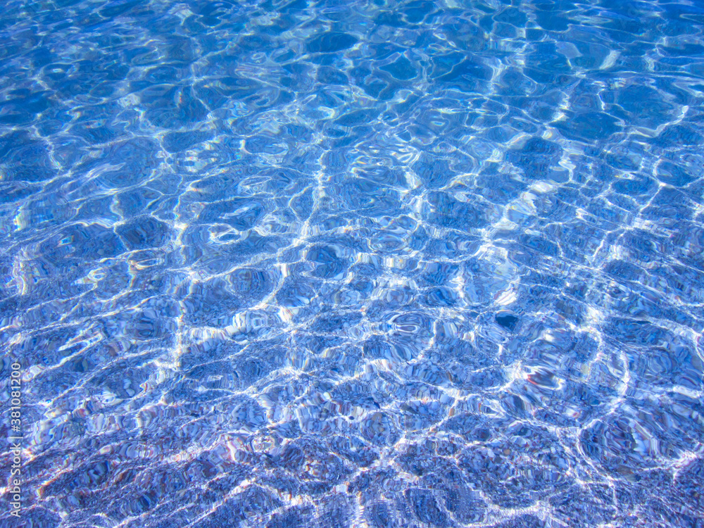 Transparent water, small waves.