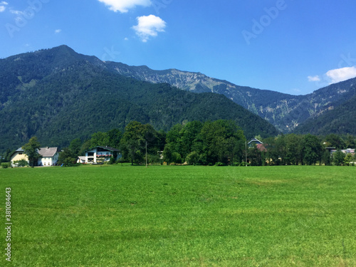landscape with grass and houses in Austria mountain at sunny day