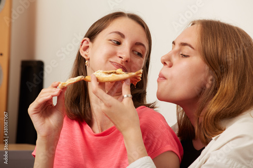 girls eating pizza