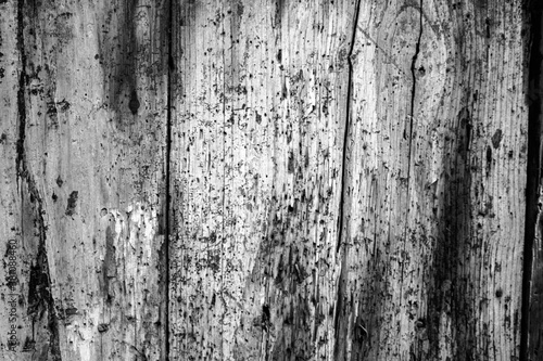 evocative black and white image of texture of old vertical wooden planks