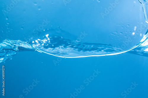 Water surface isolated on a blue background with bubbles