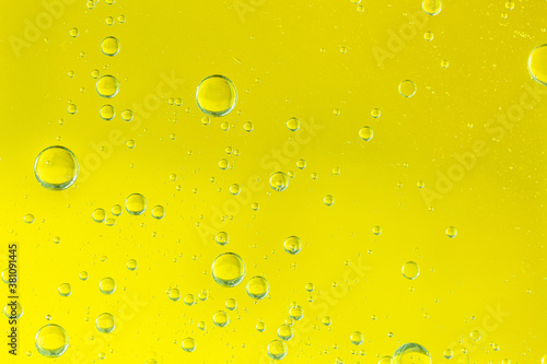 golden drops of oil or serum surface background
