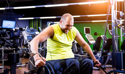 Disabled man training in the gym of rehabilitation center