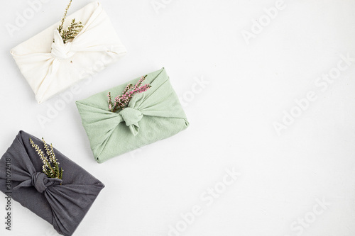 Zero waste gift wrapping traditional Japanese furoshiki style. Plastic free hand made gift package photo