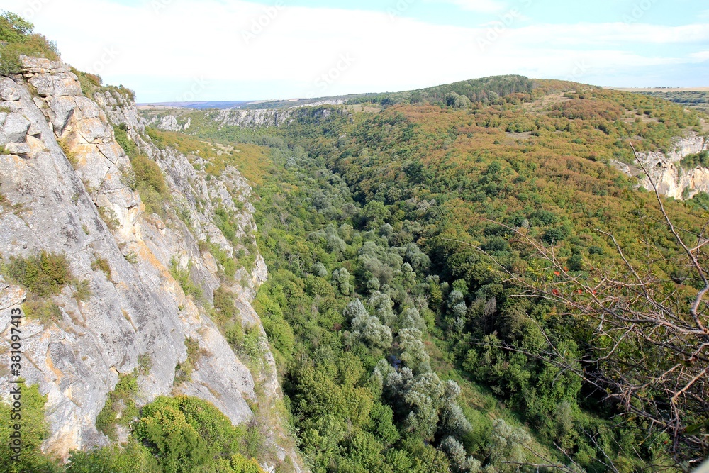 Fototapeta premium Rocks in the vicinity of the Orlova Chuka cave and the Cherni Lom river in Bulgaria in autumn
