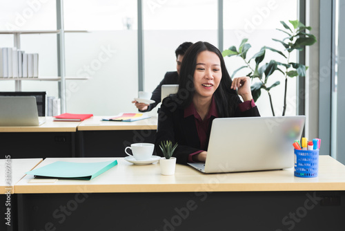 Asia business woman with computer in office  © chachamp