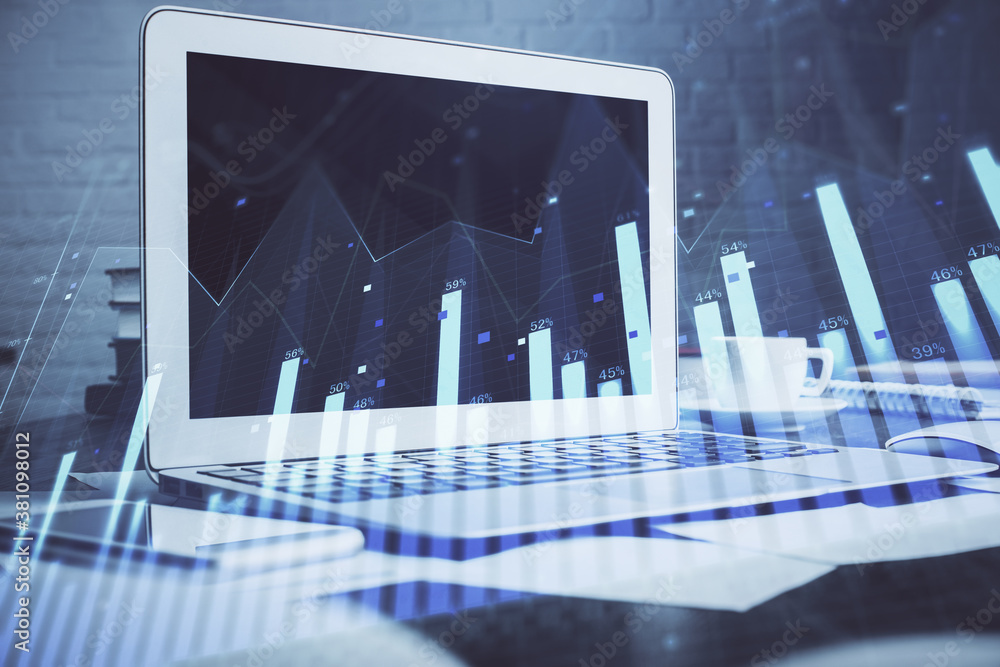 Forex Chart hologram on table with computer background. Double exposure. Concept of financial markets. Forex Chart hologram on table with computer background. Double exposure. Concept of financial markets.