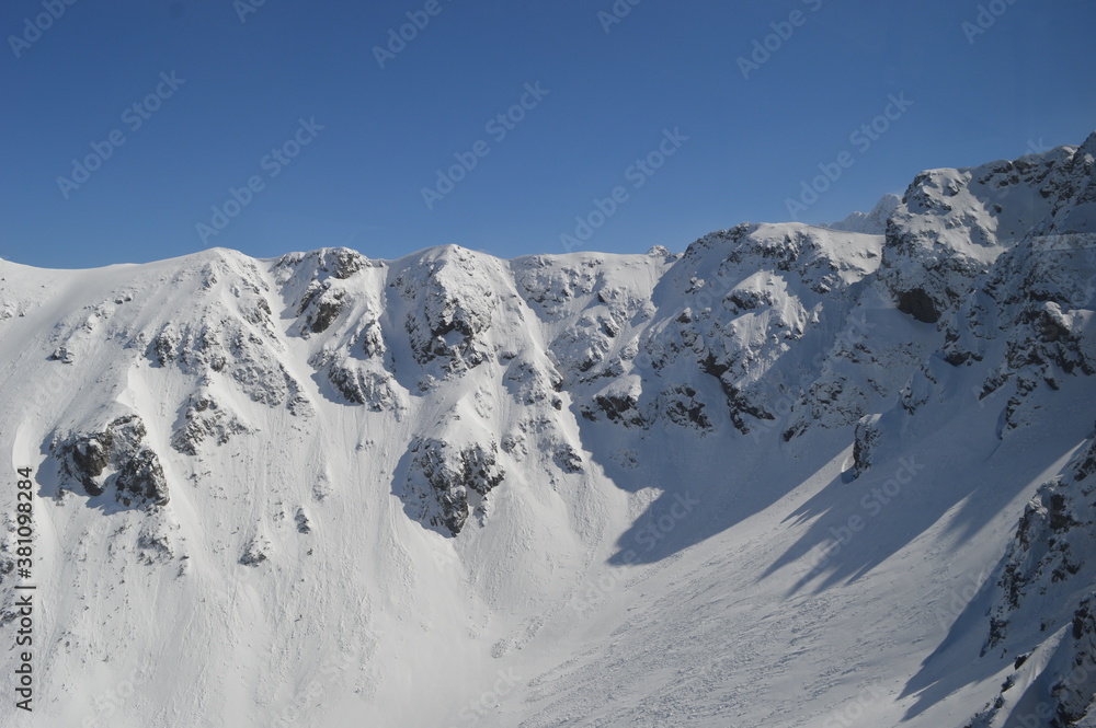 Skiing and snowboarding in the Jasna and Zakopane ski resorts between Poland and Slovakia in the Tatra Mountains