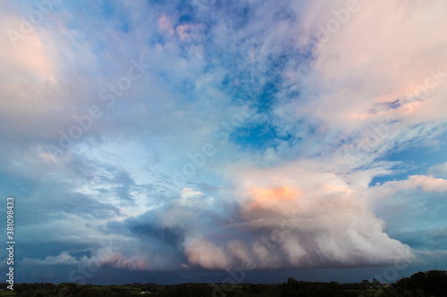 Dramatic cloudscape & mountainscape from Anglesey of storm clouds above the Snowdonia Mountain Range, North Wales 