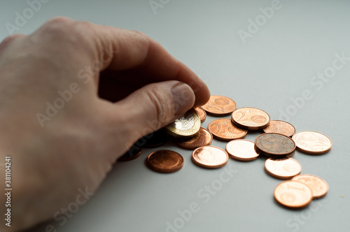 Copper Euro coins in hands