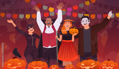 Halloween party. A group of young people dressed in outfits celebrate the holiday. Happy men and women dancing