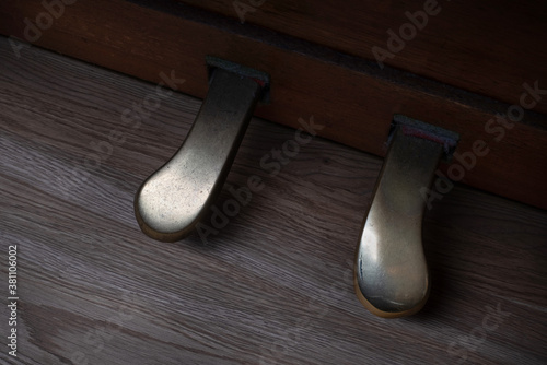 Shabby vintage piano pedals. Selective focus photo