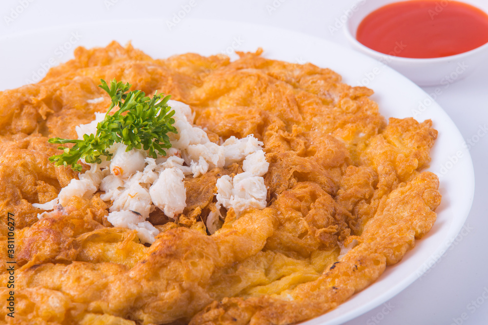 Popular Thai food. Crab omelette in the white dish. Popular Thai food. Crab omelette in the white dish.