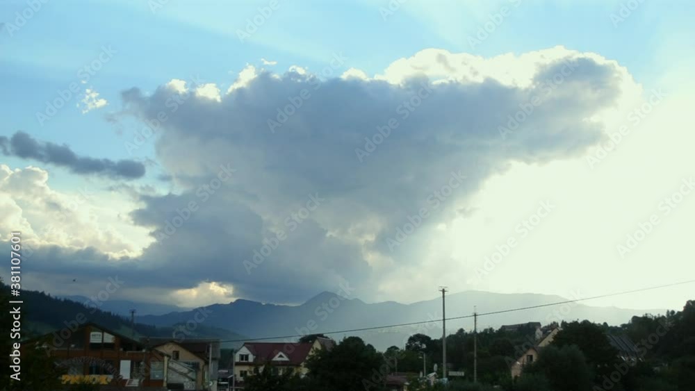 Timelapse mountain landscape with moving clouds