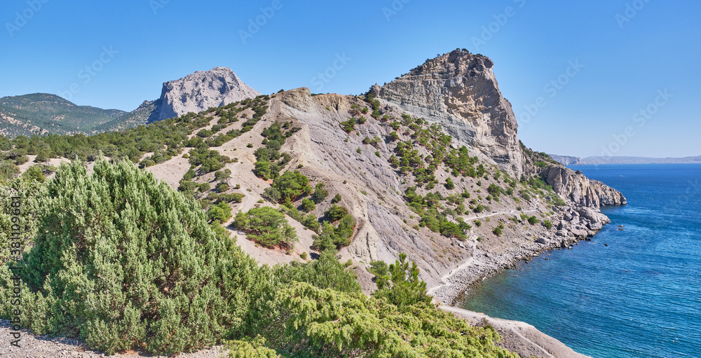 Mountain landscape, Crimean peninsula. People walk along the tourist route Golitsyn Trail. Botanical reserve New World.