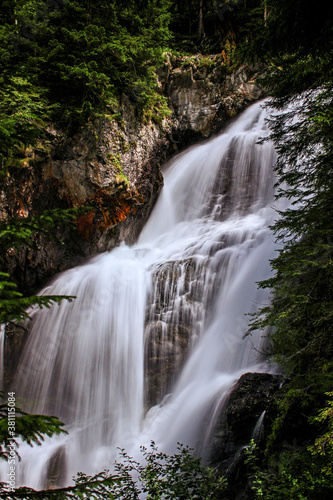 Vászonkép Mountain brook waterfall time lapse