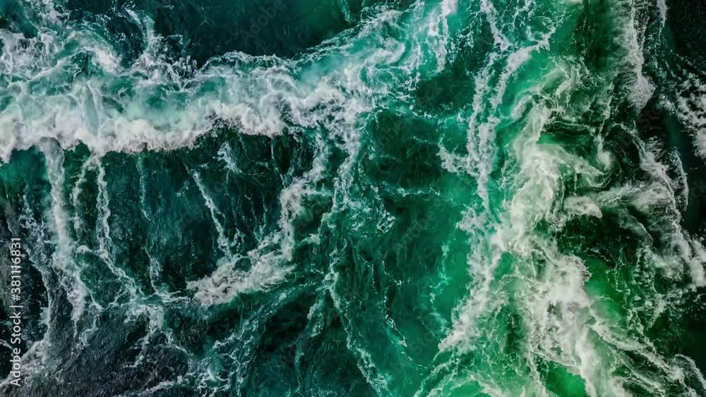 Waves of water of the river and the sea meet each other during high tide and low tide. Waves of water of the river and the sea meet each other during high tide and low tide.