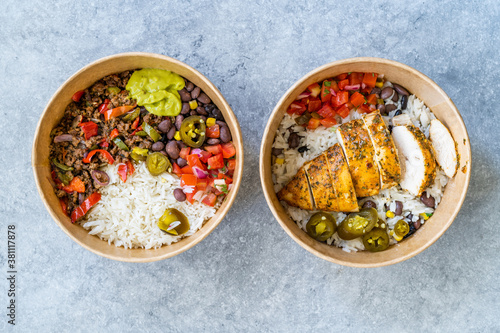 Take Away Traditional Mexican Tex-Mex Food with Minced Meat, Basmati Rice, Chicken and Guacamole Sauce in  Take Out Plastic Bowl.