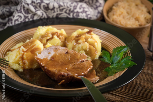 Braised pork neck in own sauce. Shallow depth of field.