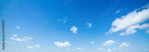 Schilderij op canvas Panoramic blue sky background with white clouds, panoramic bright summer day clo